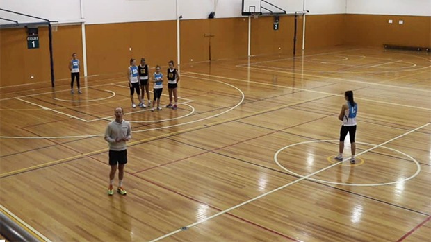 Netball coach drills centre pass strategy split